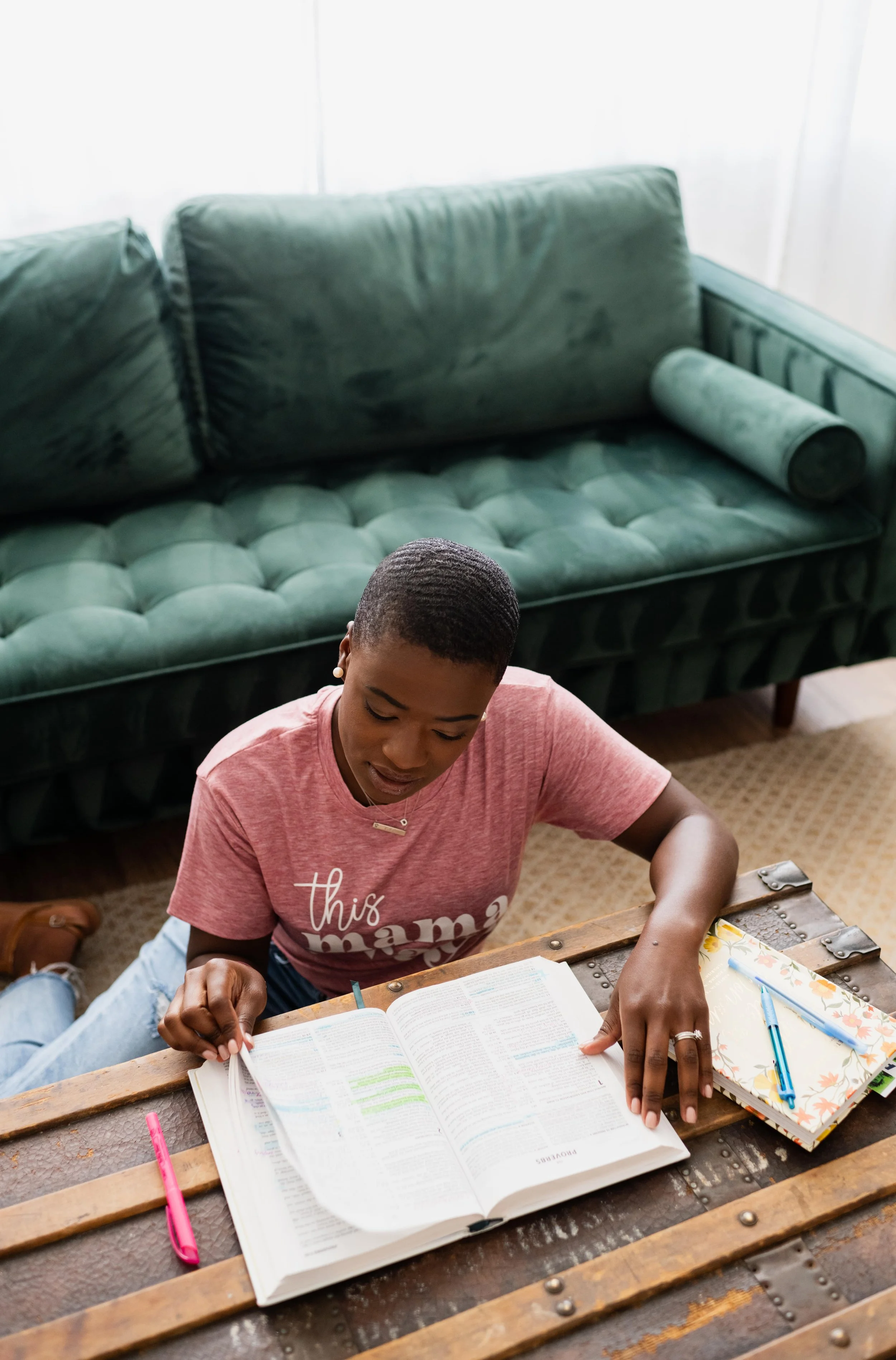 Christian Doula, Dee Larkin, reading bible in home in Tampa, Florida.