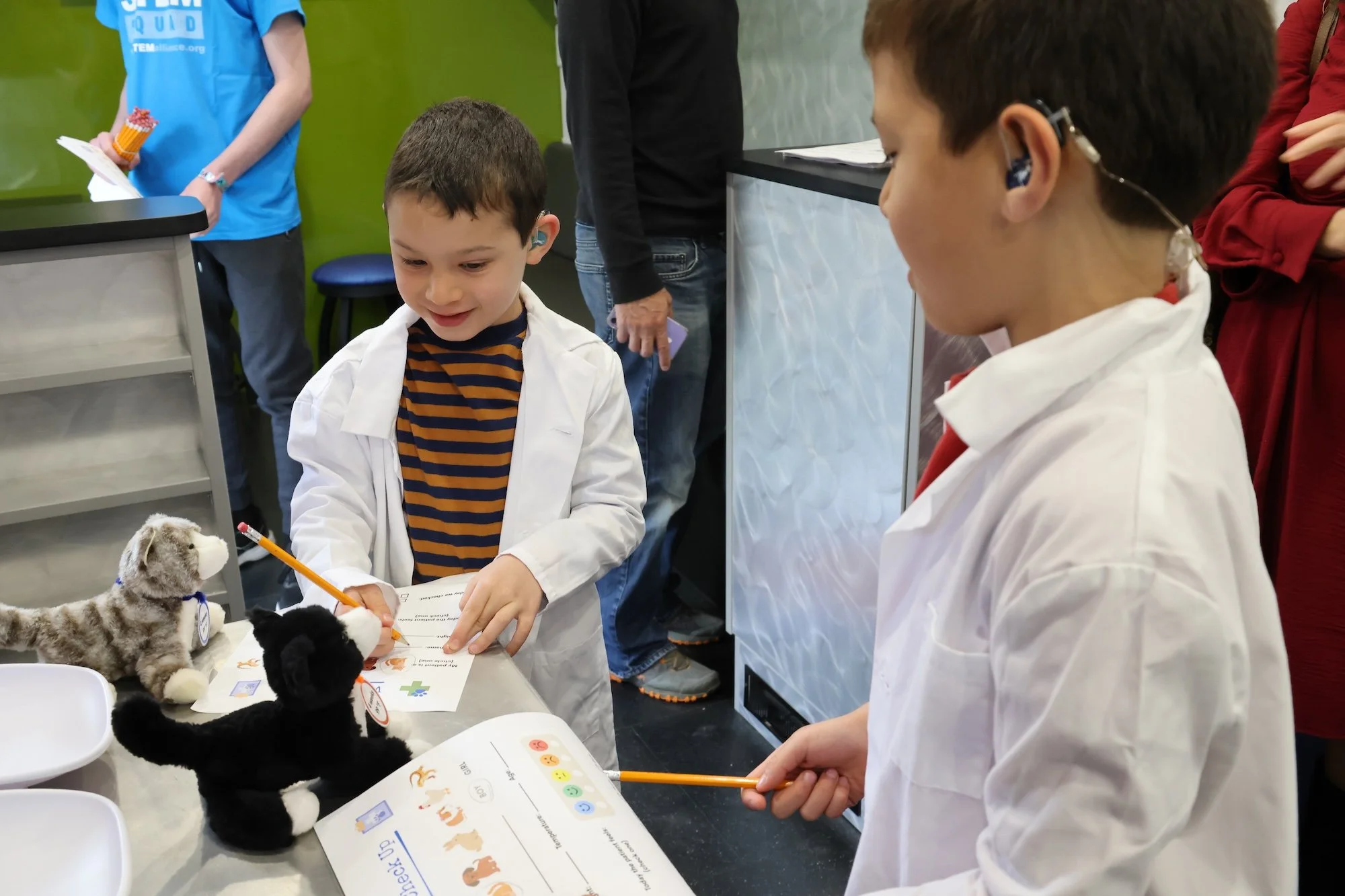 Two boys doing a STEM activity at STEM-tastic