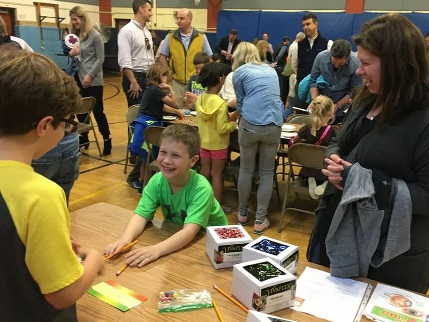 Smiling boy at table learning