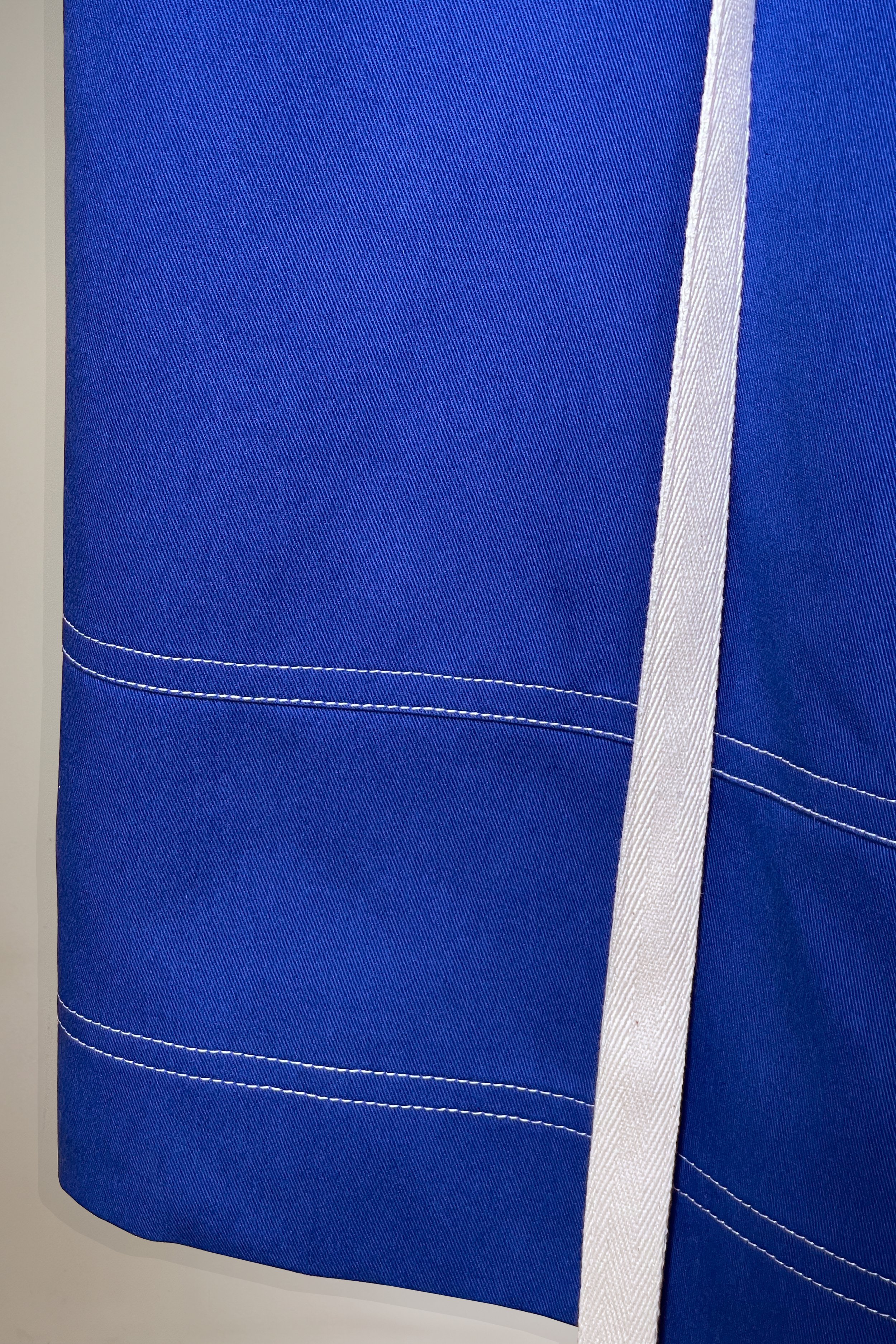 01 TROUSERS BLUE FRONT BOTTOM CLOSE UP - WHITE BACKGROUND.jpg