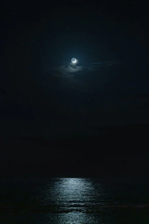 A moonlit ocean showing light reflecting on the surface. Photo by Graddes via Unsplash.