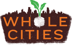 Logo with green sprout above brown earth with orange text 'WHOLE CITIES'