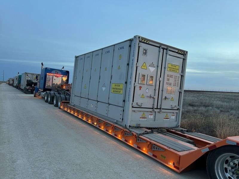 container convoy at delivery site.jpg