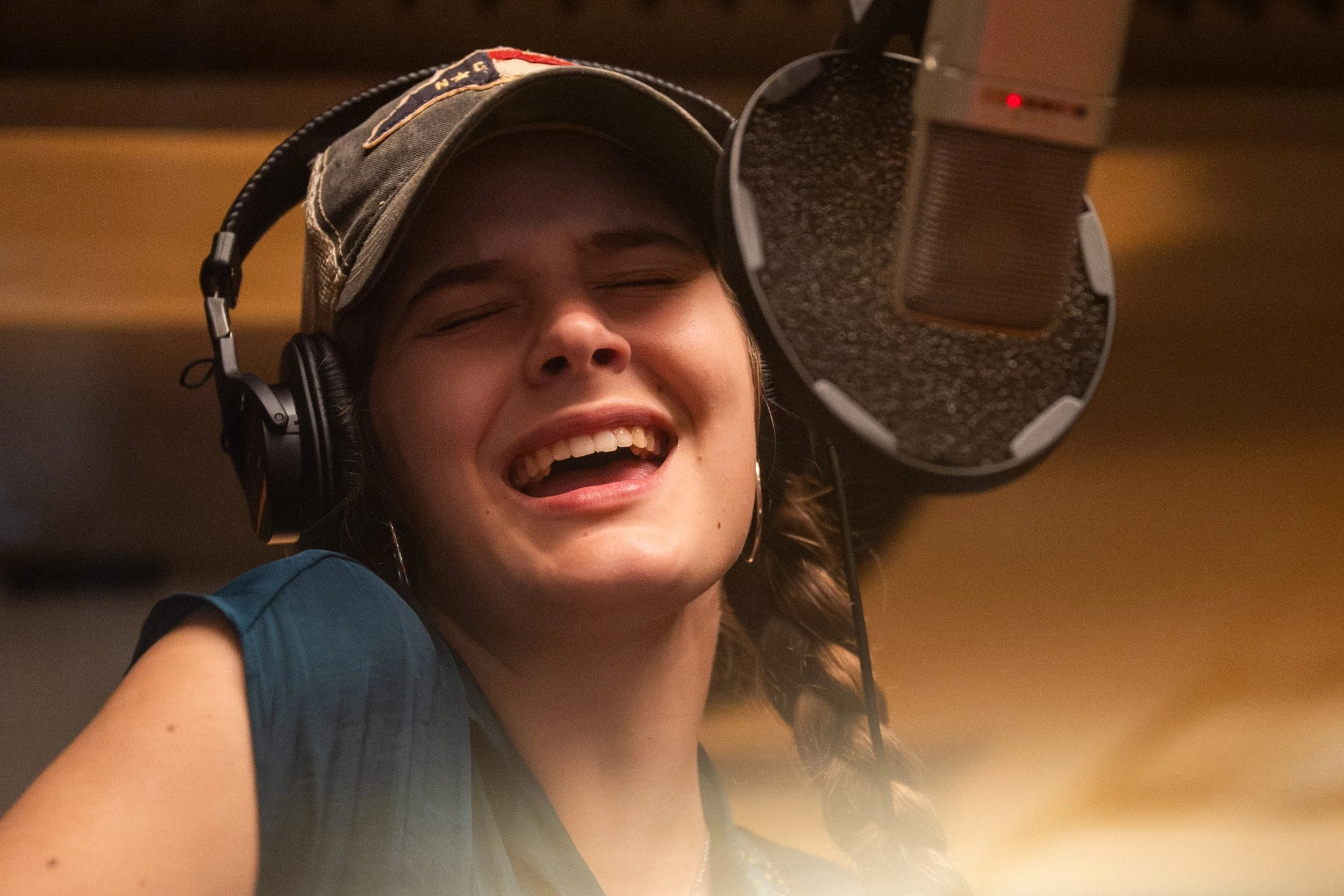 Winston-Salem, NC, Dec. 6, 2025 – Allyn sings in isolation booth.