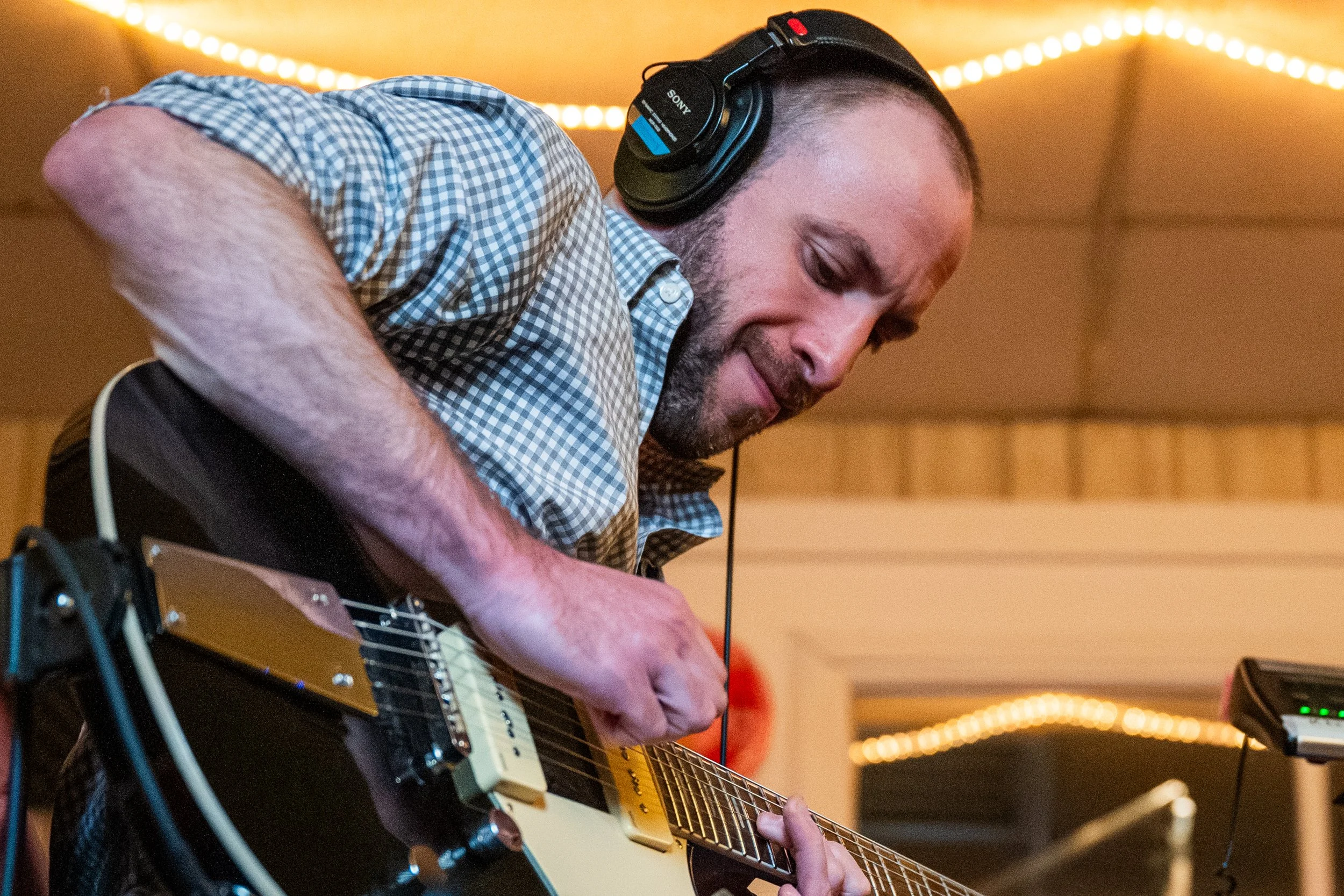 Winston-Salem, NC, Dec. 6, 2025 – Jeremy Marx plays guitar solo for one of Allyns songs.