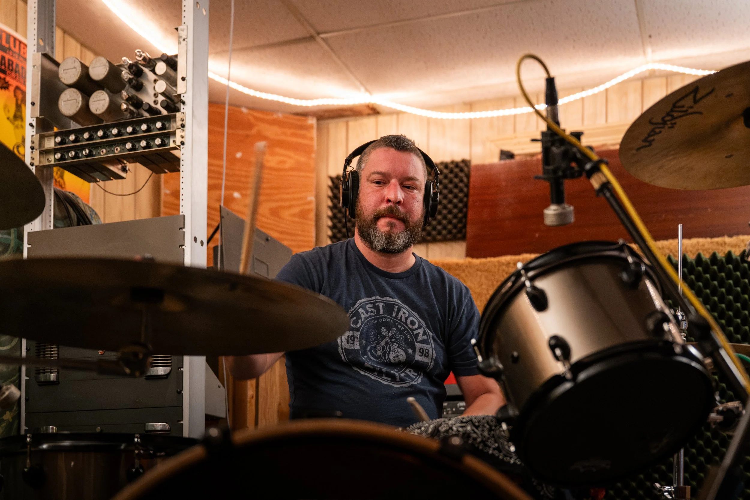 Winston-Salem, NC, Dec. 6, 2025 – Nathan Brown plays drums with several mics to record each different piece.