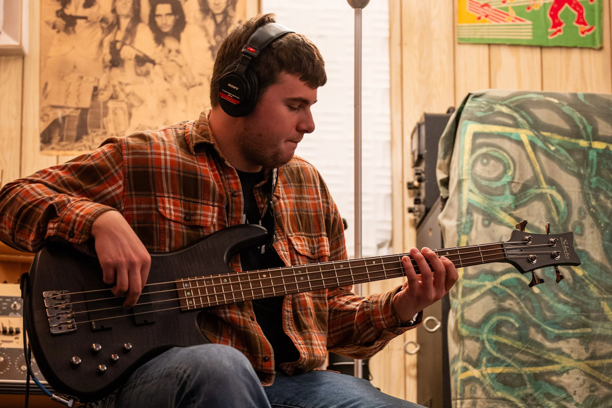 Winston-Salem, NC, Dec. 6, 2025 – Nick Jordan plays bass guitar during a recording session.