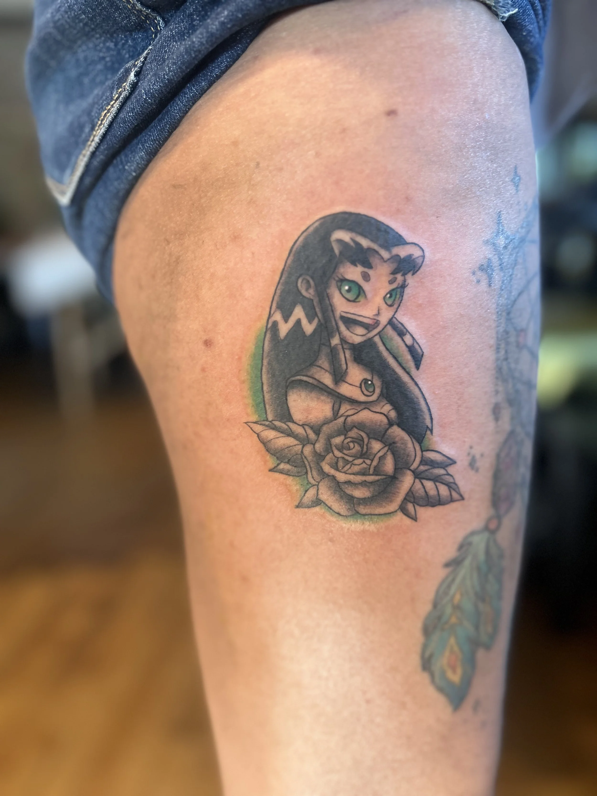 Neo‑traditional black & gray Starfire (Teen Titans) tattoo with green color pops
