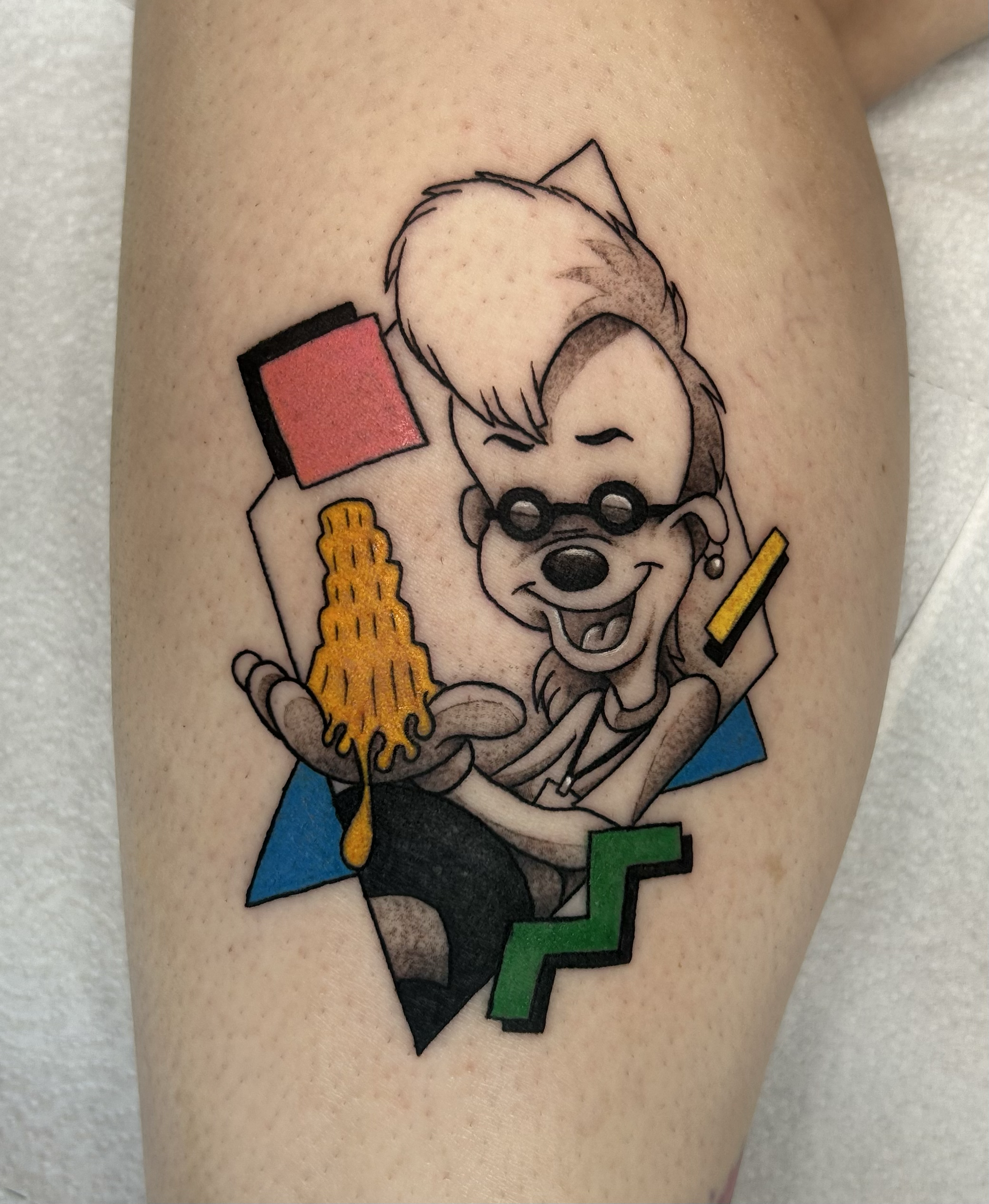 Black & gray Bobby (A Goofy Movie) tattoo holding Leaning Tower of Cheeza, ’90s pattern accents