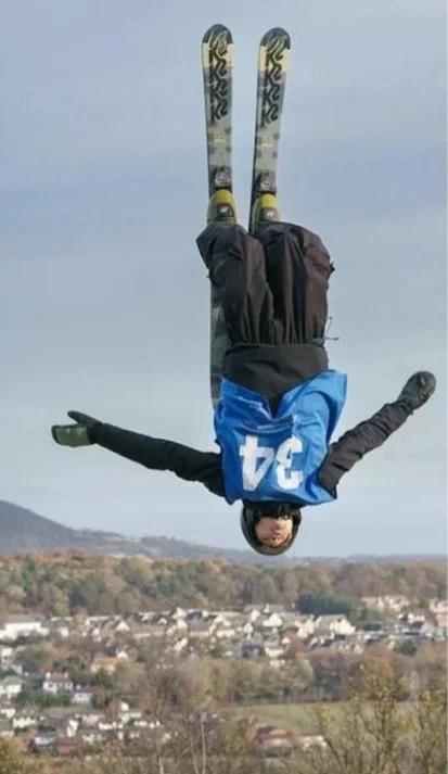 Feddie doing a flip in his baggy ski pants