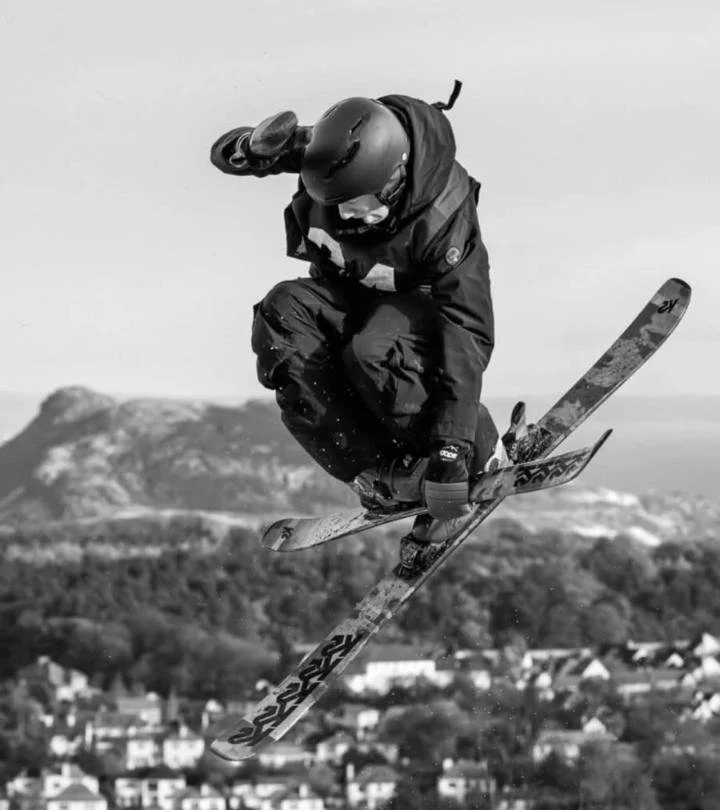 Freddie in the air spinning in he baggy ski pants