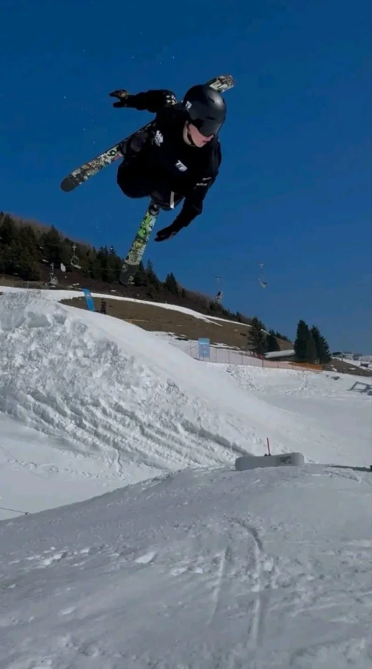 Jacob spinning off a jump with his baggy ski pants