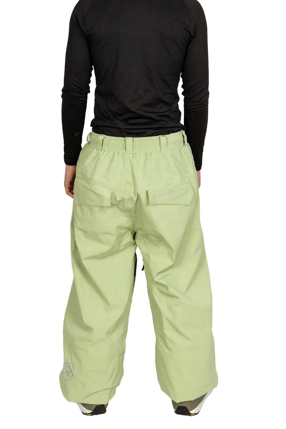 Back view of Snowripper Drift Pants in Mist Green showing relaxed freestyle cut.