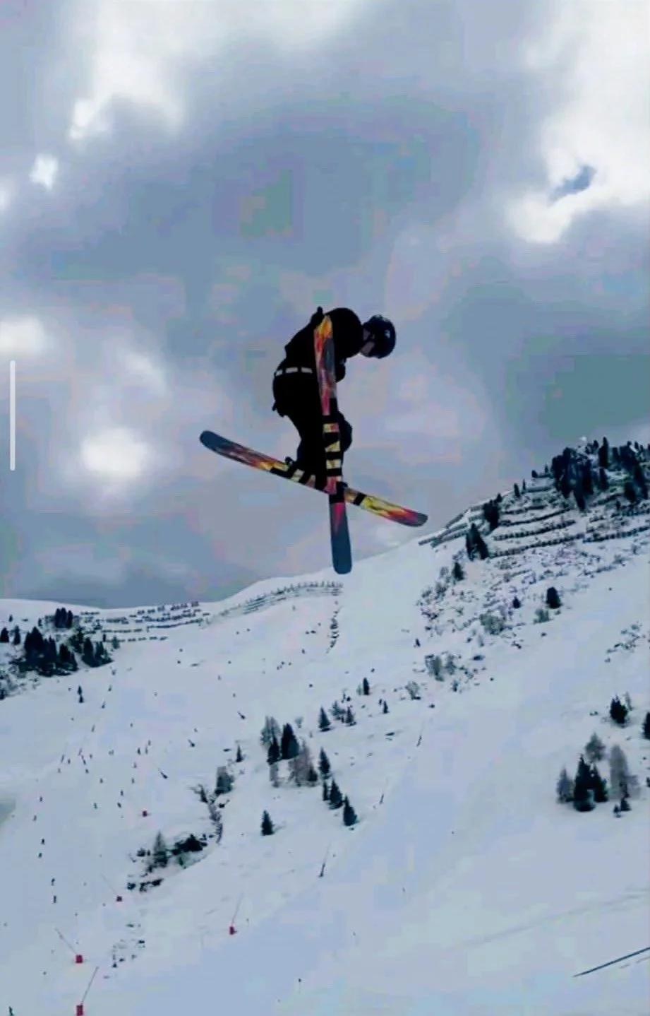 Jacob in the air spining with his baggy ski pants