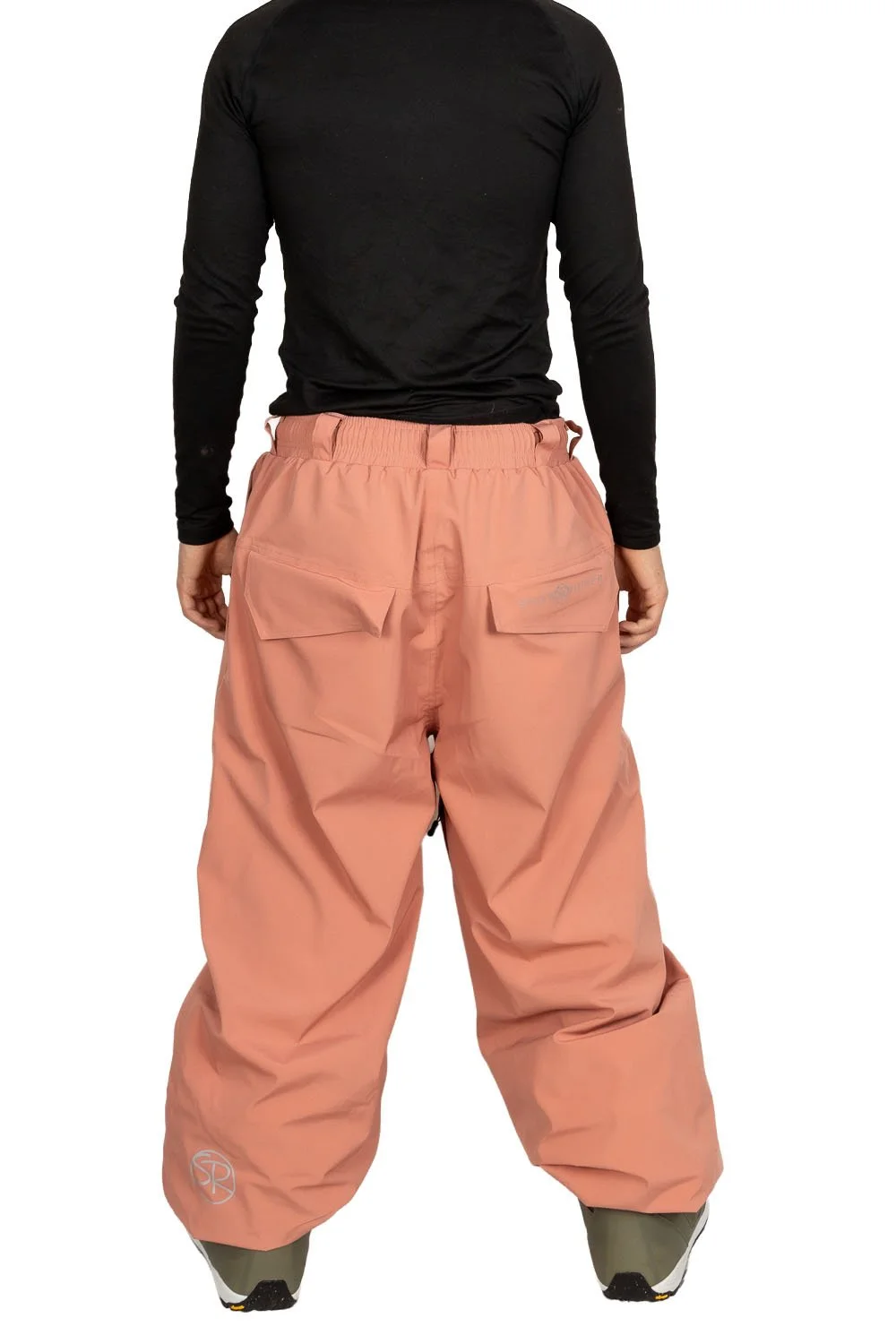 Back view of Snowripper Drift Pants in Coral Beacon showing relaxed freestyle cut.