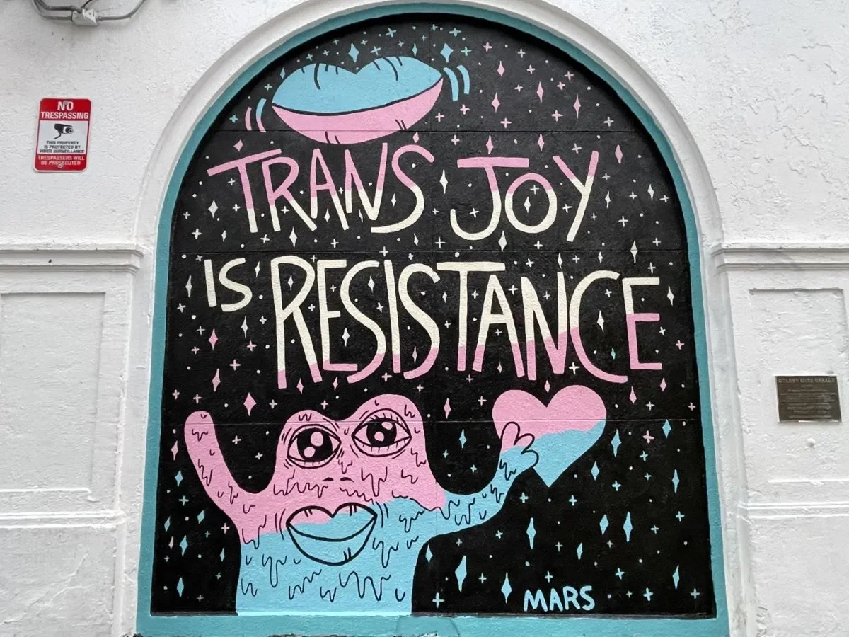 Mars Wright’s mural in San Francisco's Transgender District features a “transcestor” Martian, trans pride colors and a phrase he coined to get through difficult times and to celebrate his transness. (JL Odom/Bay City News)