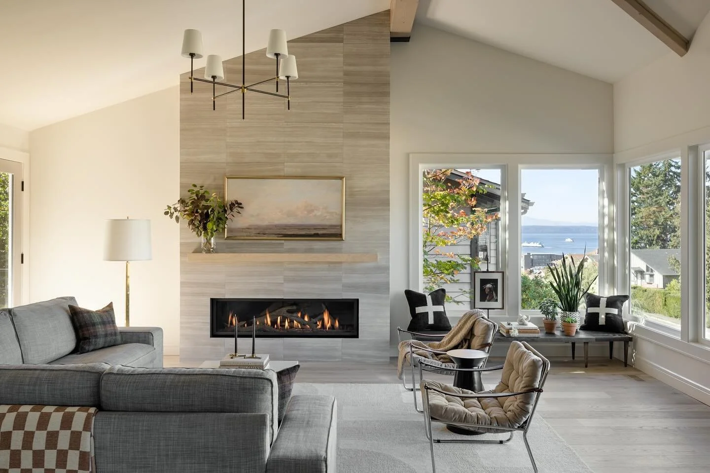 Swipe to see the before photos! This Edmonds home is situated on the hillside overlooking the Edmonds Bowl and Puget Sound beyond.  The project entailed a full remodel of the main floor of the home including reconfiguring the kitchen, vaulting the ma