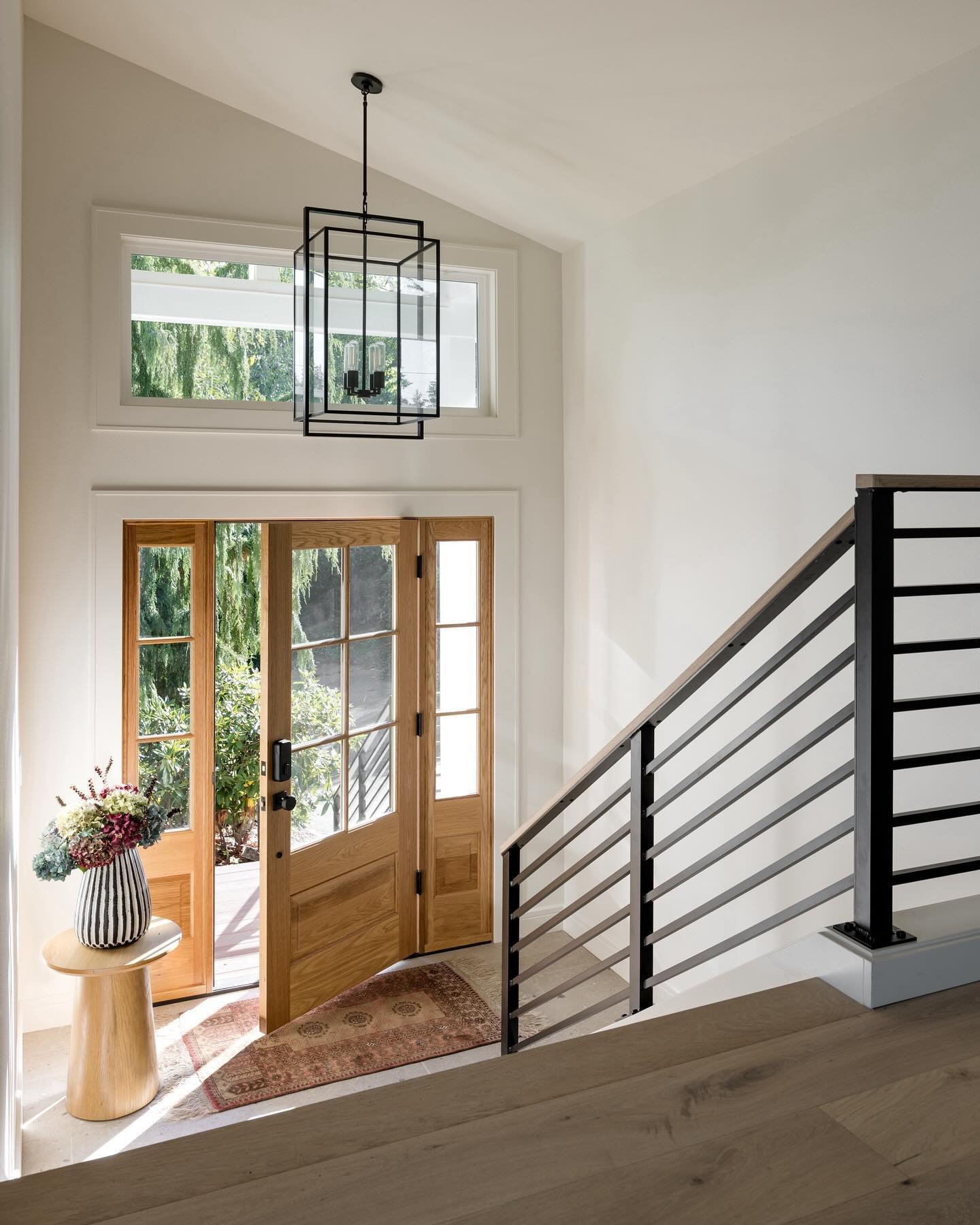 Let the light in ☀️

This stunning entryway is a perfect blend of natural light and thoughtful design, creating a warm and inviting space from the moment you walk in ✨

The original flat ceiling was replaced with a vaulted ceiling, along with the add
