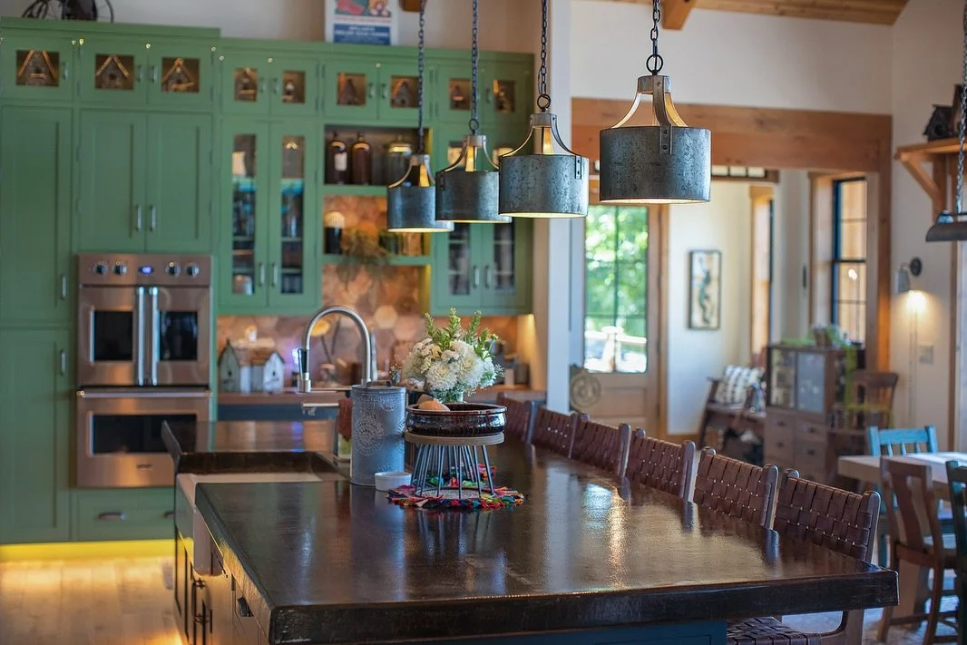 The heart of the home 💚

Every detail of this waterfront cabin was thoughtfully curated by its owners &mdash; a true labor of love, layered with personality and comfort

From the bold green cabinetry to the warm wood accents and industrial pendant l