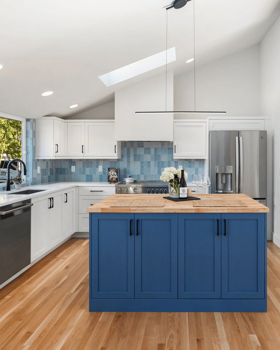 A fresh take on coastal-inspired design.

This kitchen, in H2D's Beacon Hill rehab project, pairs crisp white cabinetry with a bold blue island to create the perfect balance of timeless design and statement-making. The butcher block countertop adds w