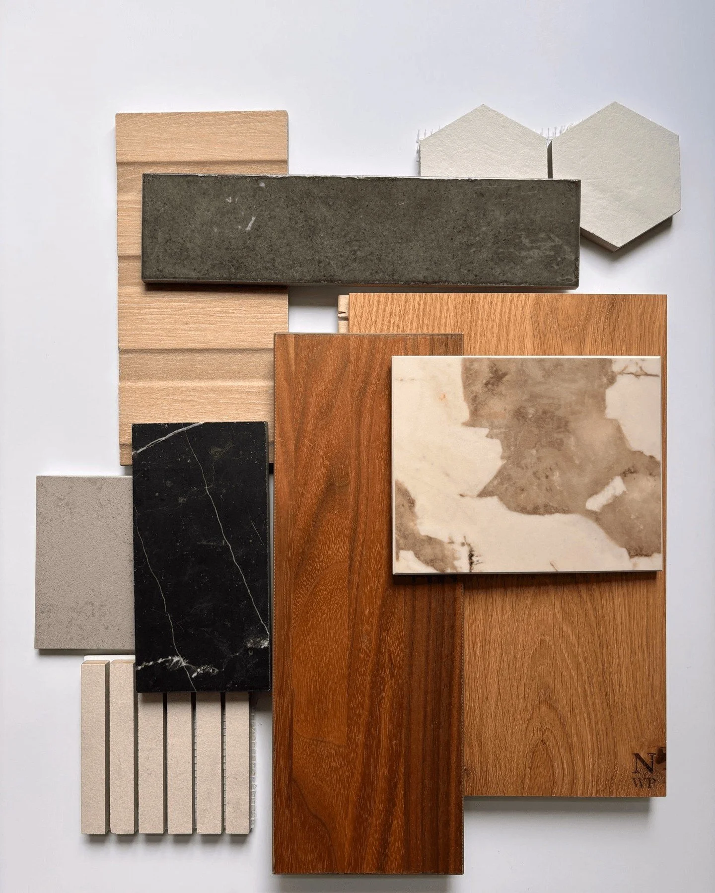 Design lives in the details!  H2D is preparing interior finishes for a new remodel project!

With this iteration of finish selections, our design team is exploring the contrast of black marble against honed gray quartz.  The warmth of walnut cabinetr