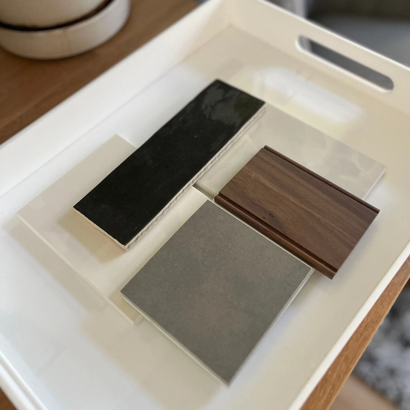 Our Interior Designer, Lauren, is busy working up concepts for a new project. 

This palette blends natural warmth with architectural contrast. The oak hardwood flooring and walnut cabinets are layered against dimensional grays and refined slab surfa
