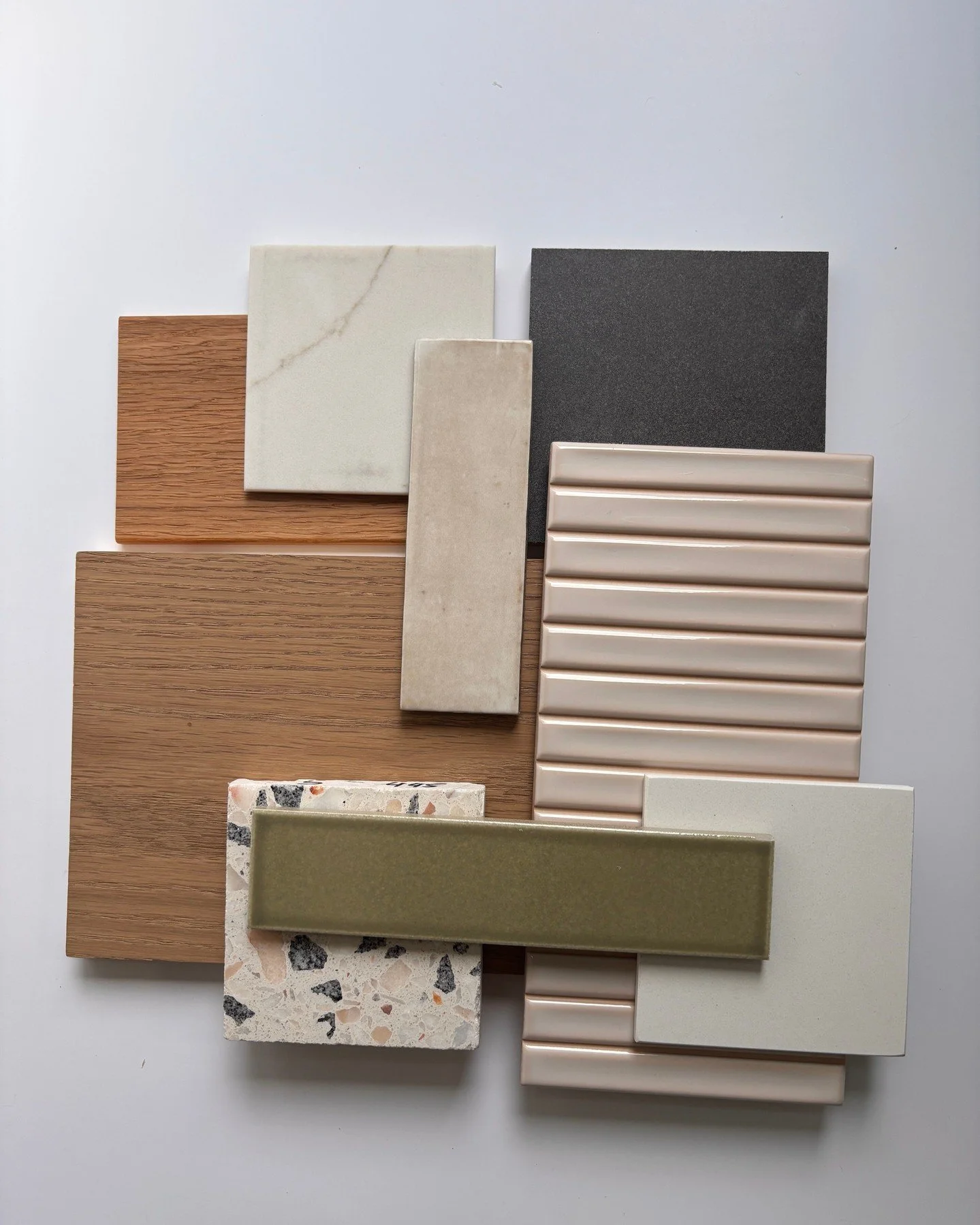 We're working through concepts for our upcoming Phinney Ridge remodel. Our clients asked for organic, mid-century modern finishes with lots of wood and natural materials and textures. The Zia Tile Ponderosa green tile is a nod to their favorite color