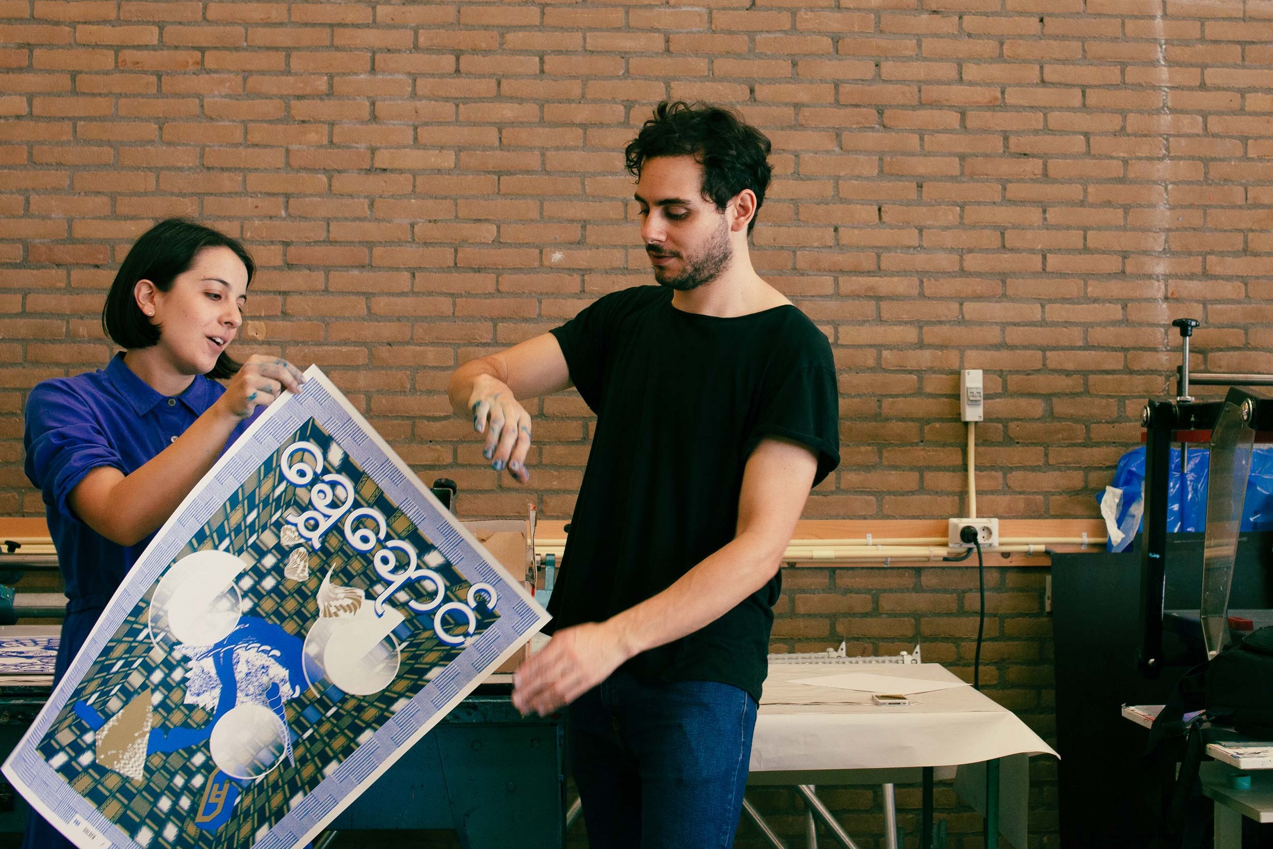 Design & Other holding 'Golden' silkscreen print