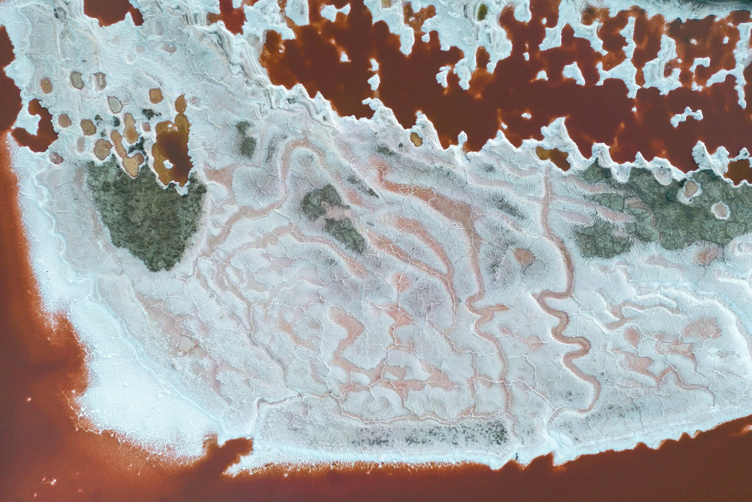 A woman lying in water, looking content