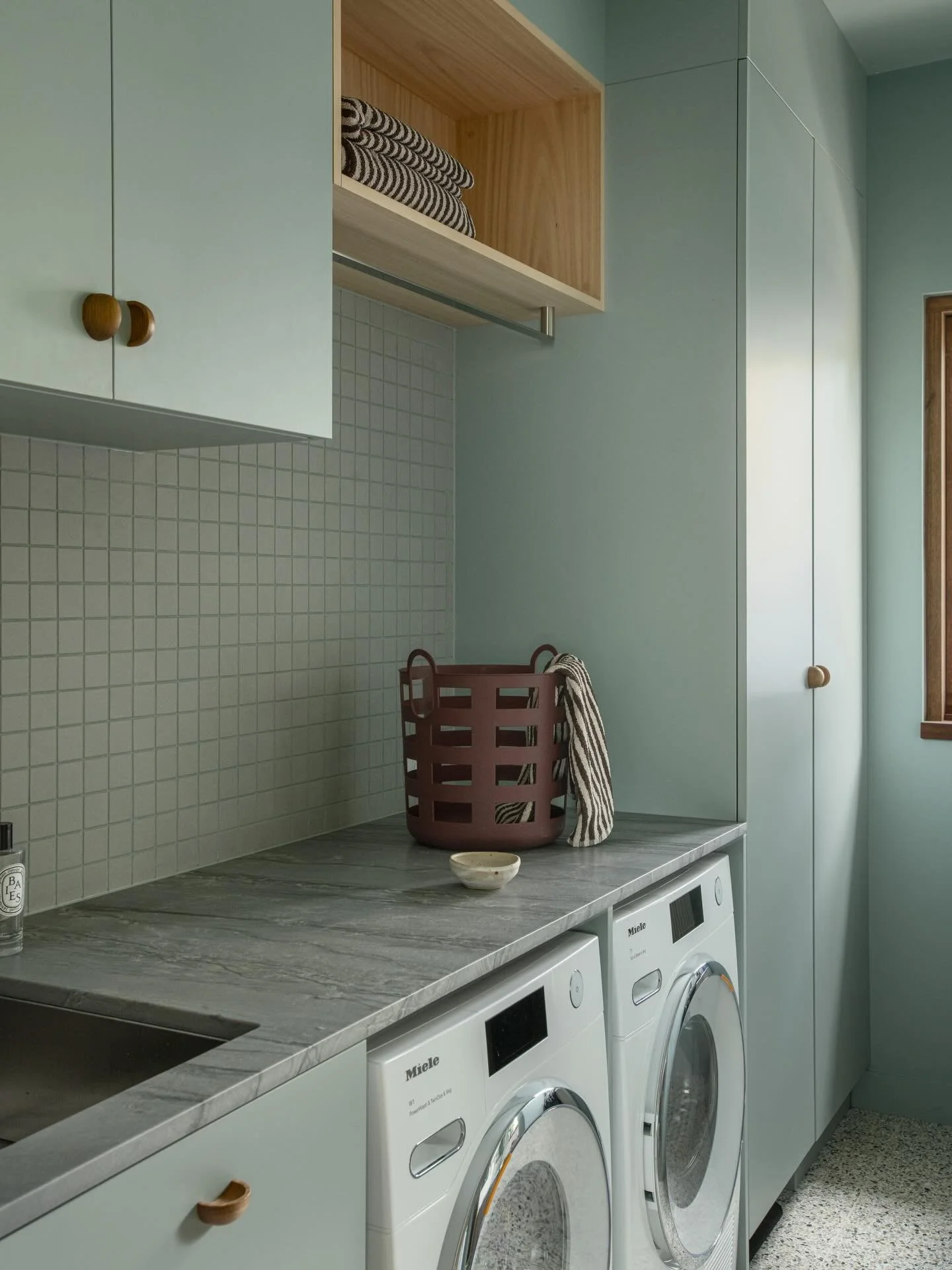Would you believe this was once a washing machine in a cupboard and the pokiest little toilet? We managed to create a seperate powder room in some dead hallway space and landed on a laundry that actually functions. Almost makes the washing feel less 