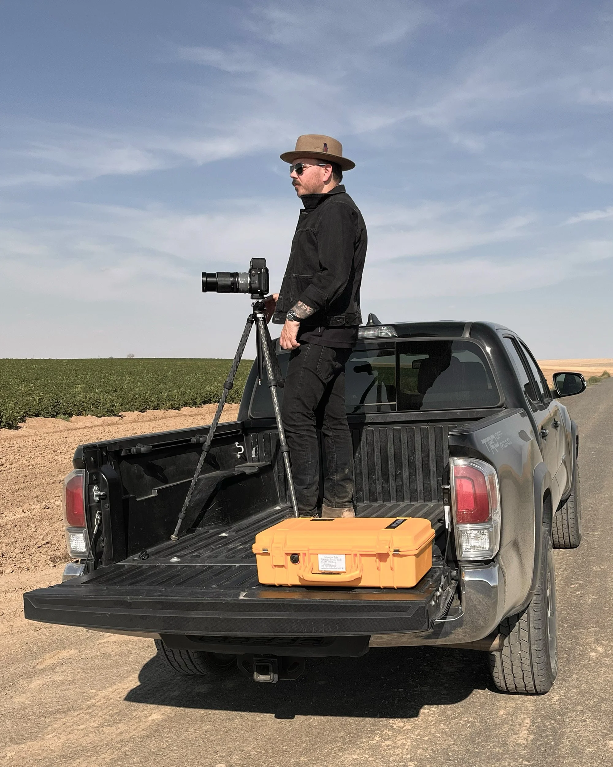 Documentary photographer Sebastian Bahr working in rural landscape with medium format camera