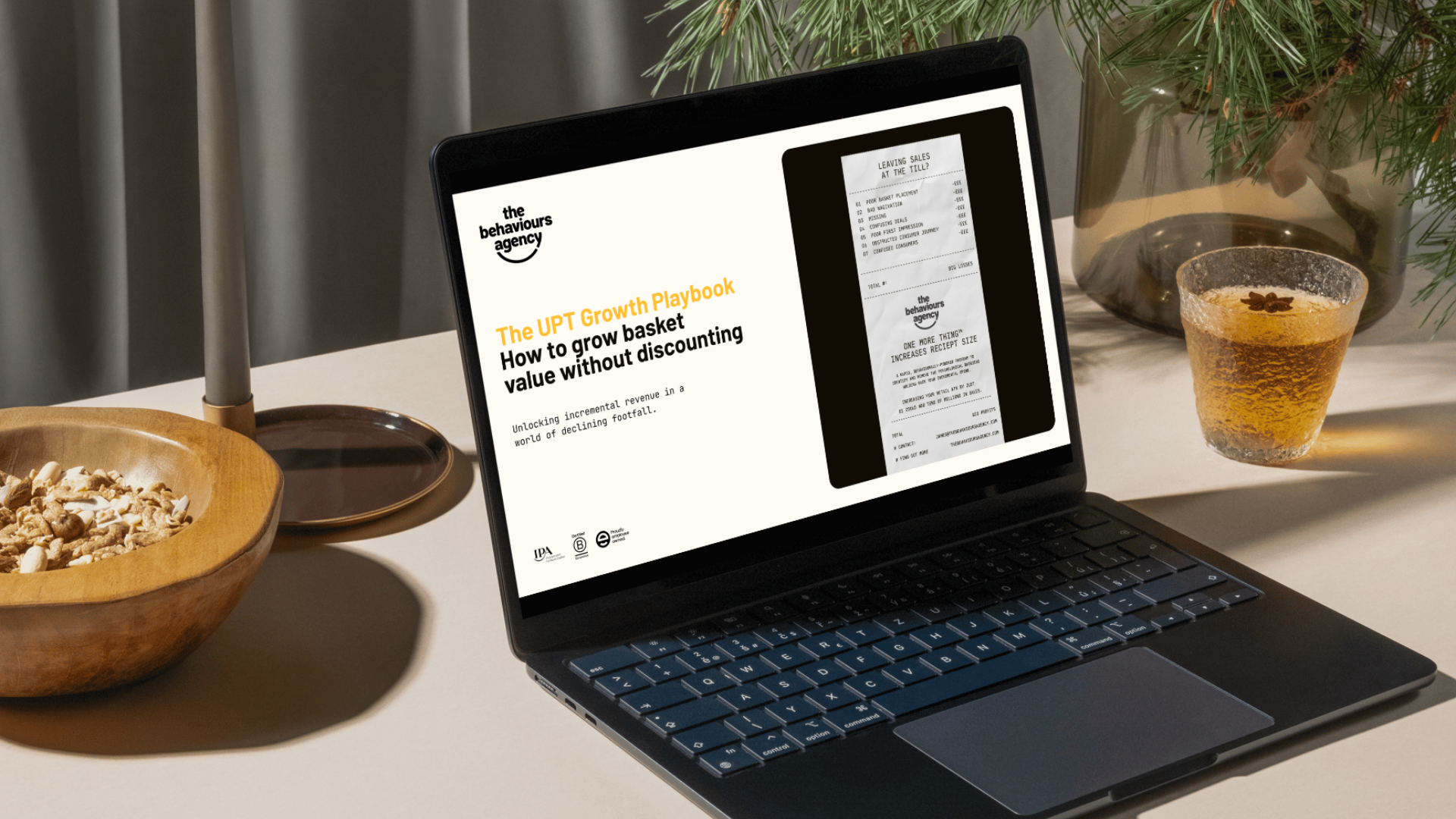 laptop screen showing the front cover of the UPT Growth playbook