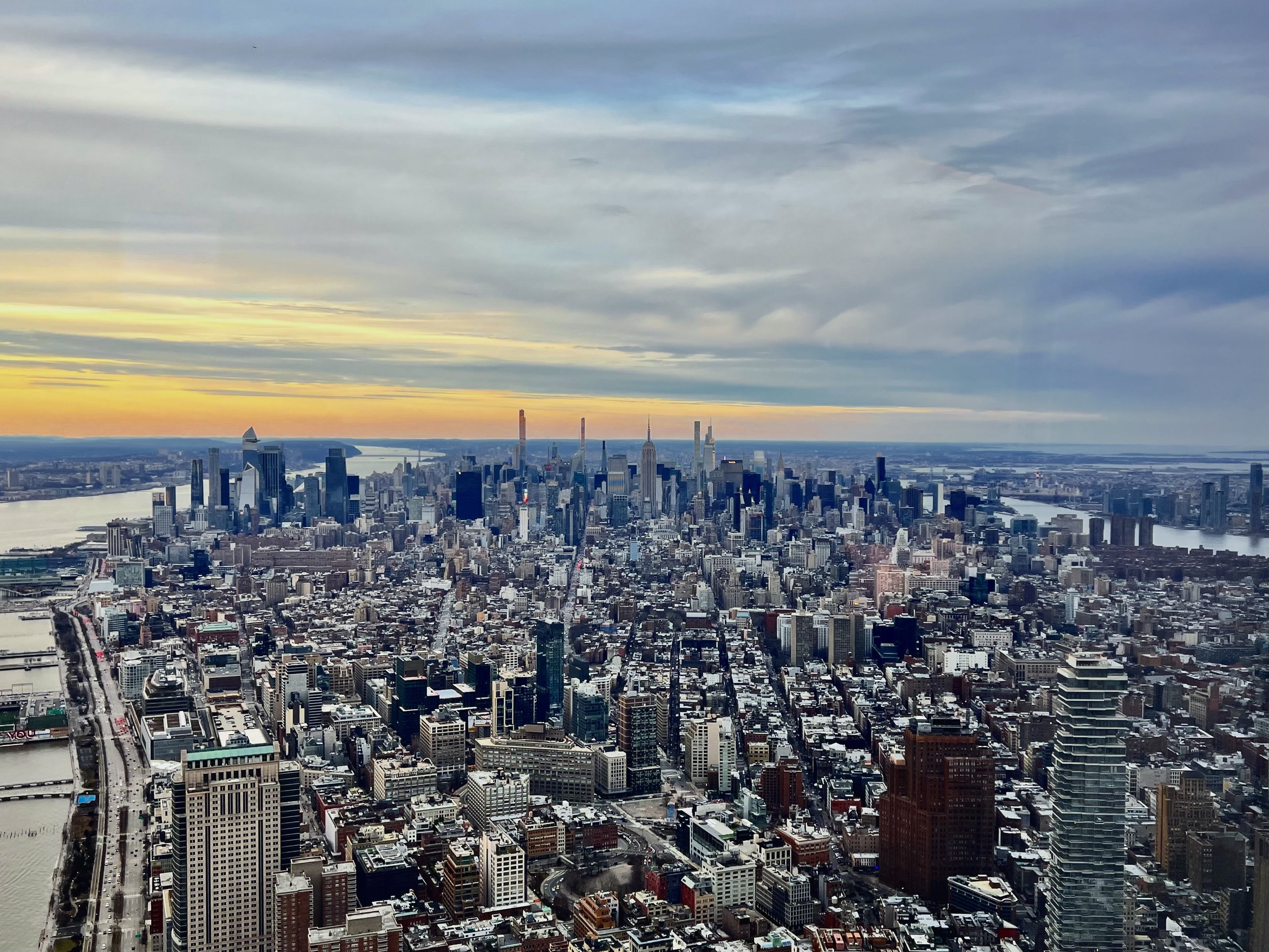 Manhattan skyline at sunset, photographed from One World Observatory, photo by Sari Kutch, LCSW.