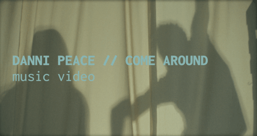Text overlay on a curtain background reading 'DANNI PEACE // COME AROUND music video' with shadowy figures behind the curtain.
