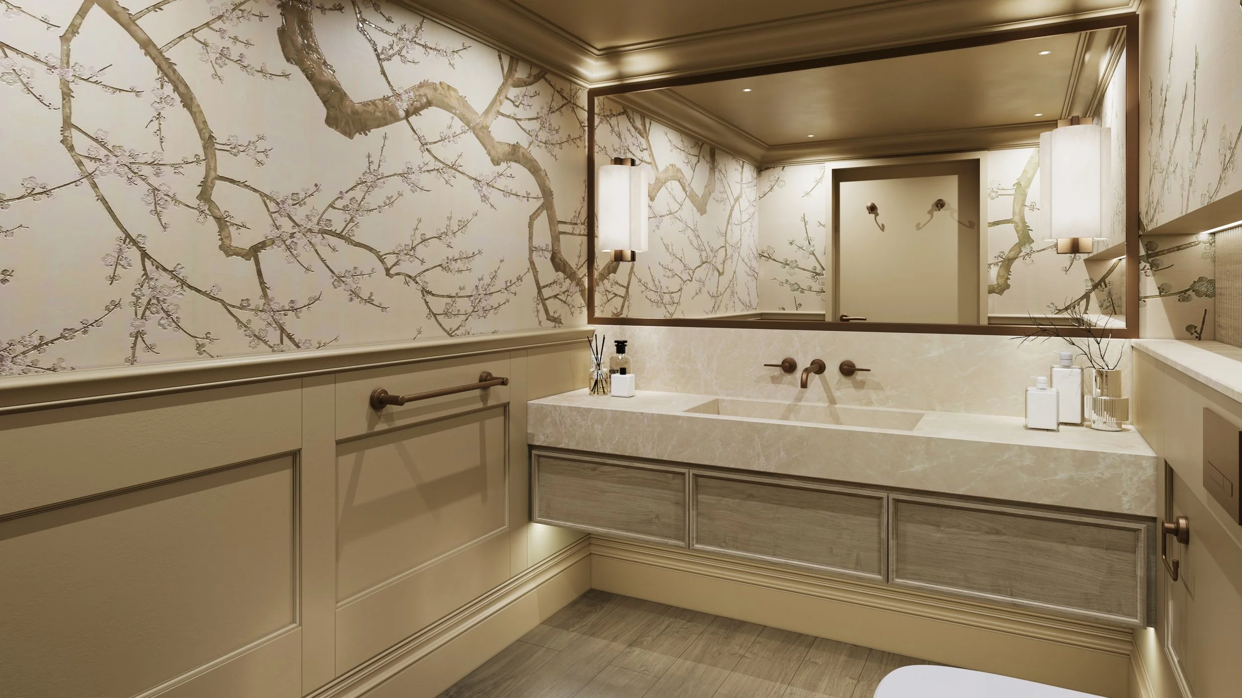 Luxury residential toilet interior featuring a large rectangular mirror with warm recessed lighting, marble sink vanity unit with grey oak drawer fronts, and wall-mounted bronze faucets. The walls are decorated with beige botanical wallpaper showcasi