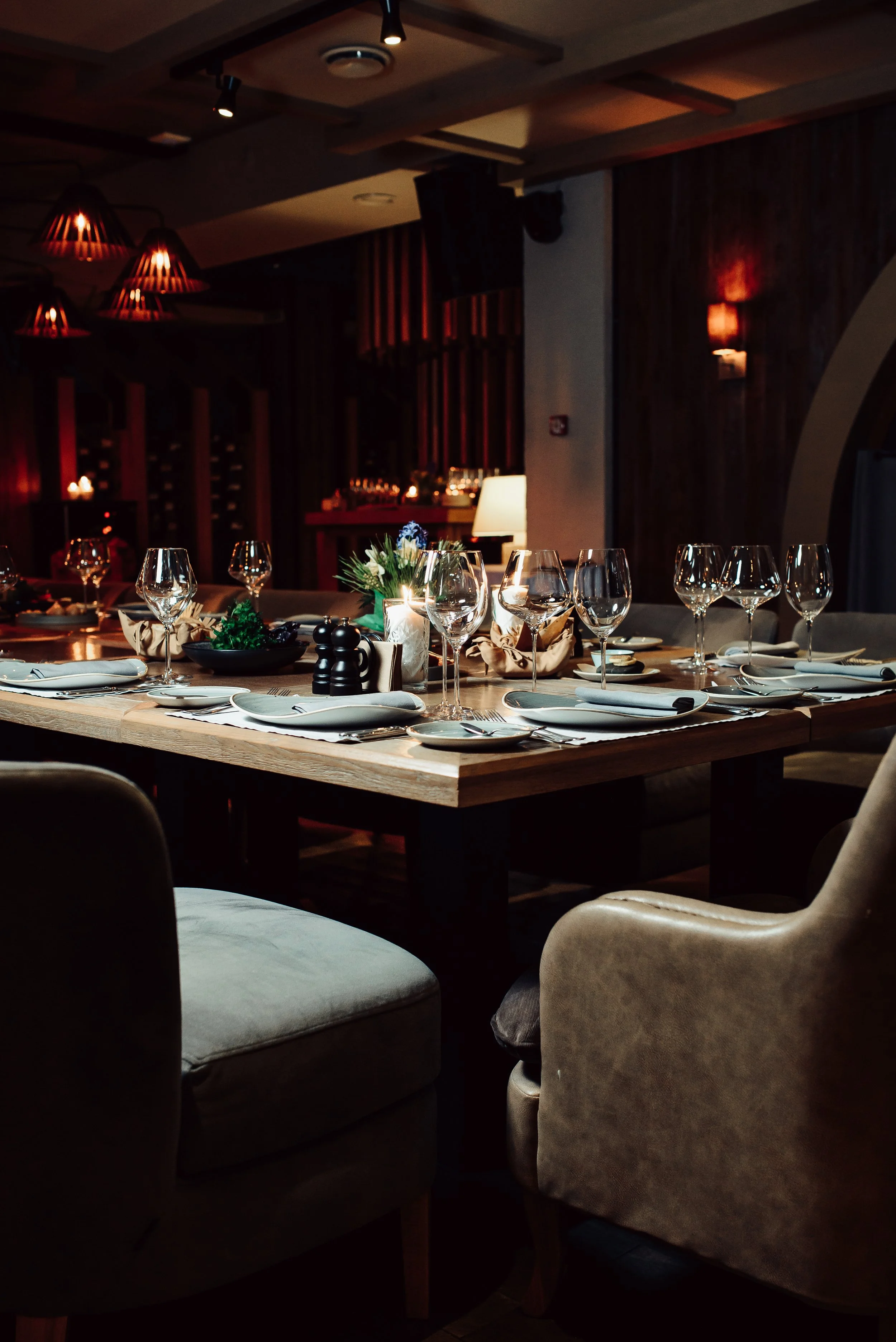 Dark dinner setting at an upscale restaurant
