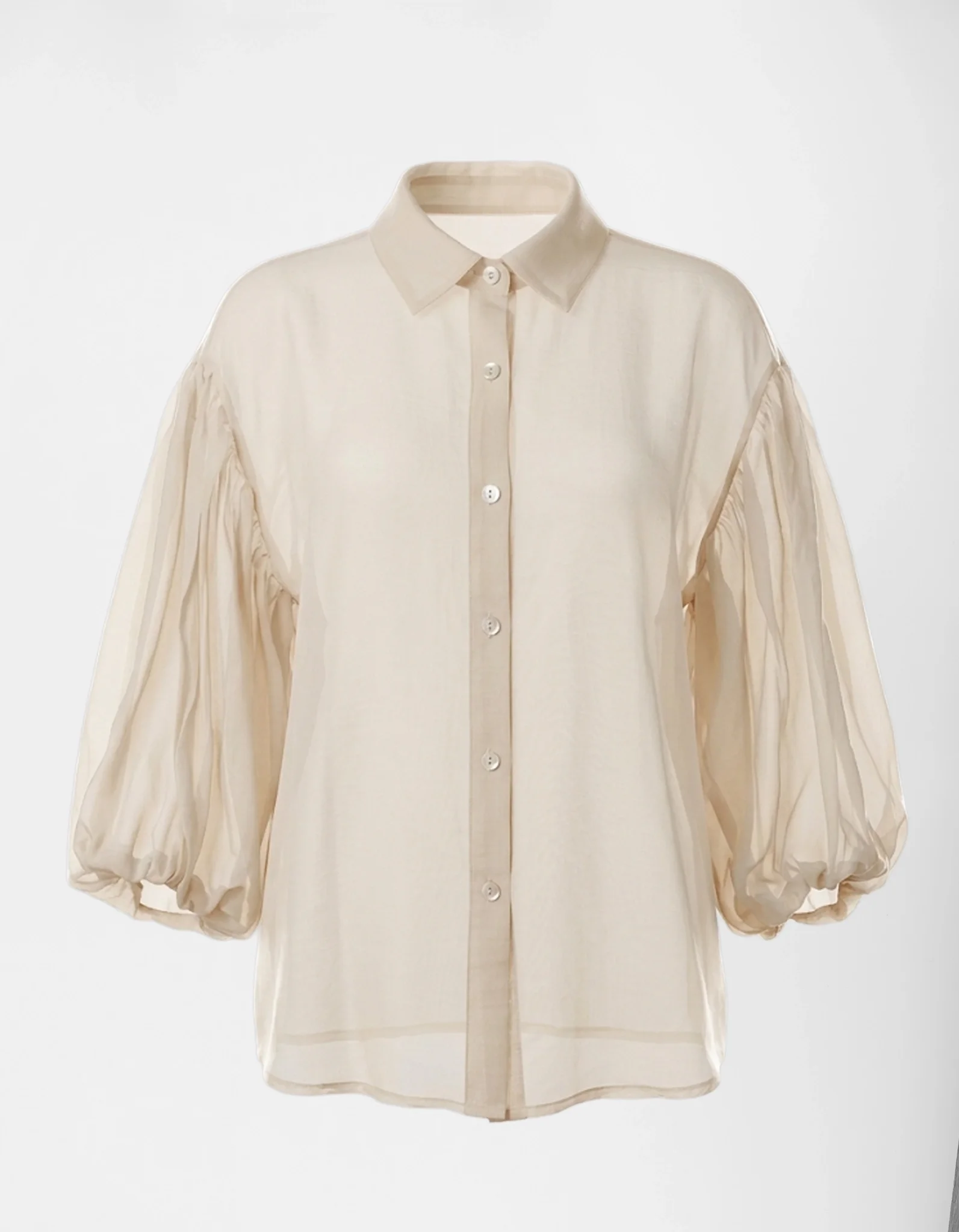Helle Baumwollbluse Mira in Creme mit leicht transparenter Struktur und weiten Ärmeln.