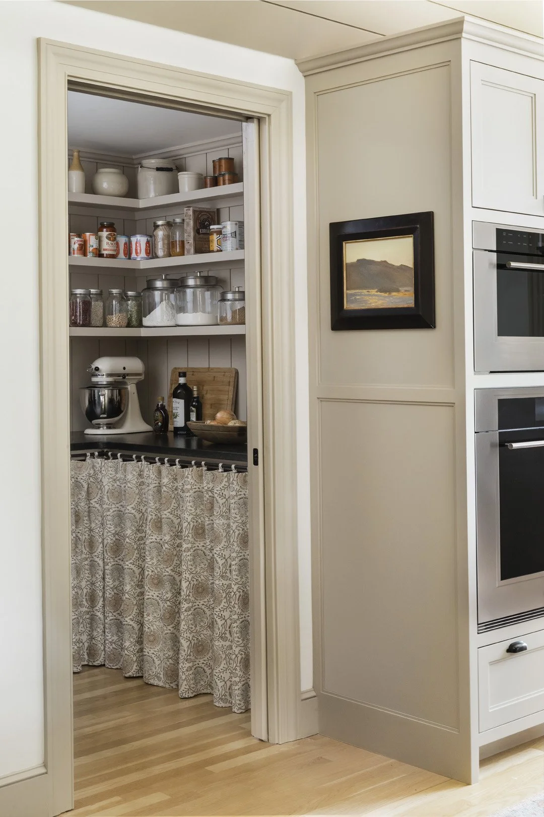 Kitchen pantry with skirted counter behind a pocket door, Newburyport MA renovation featured in Beautiful Kitchens & Baths