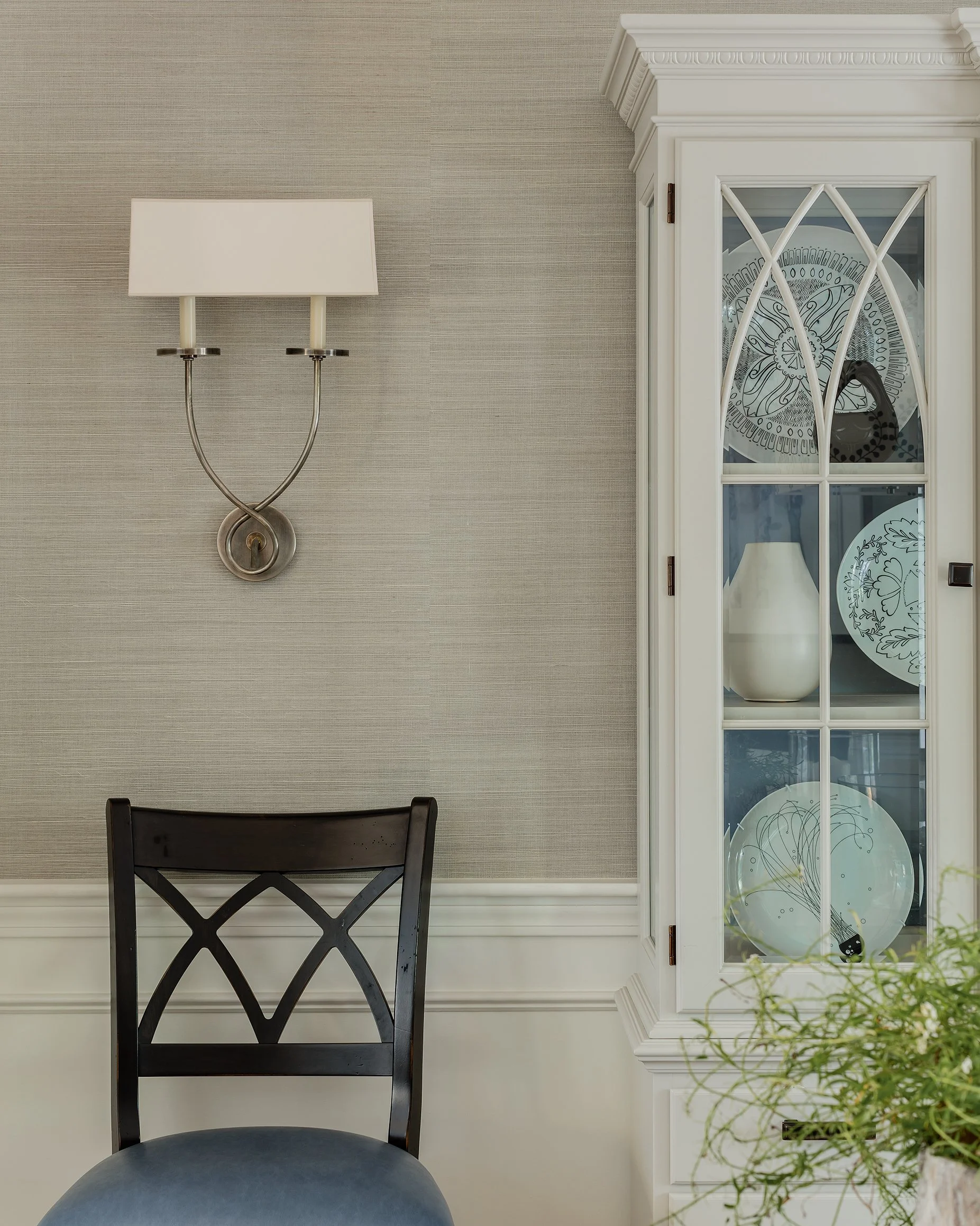 Dining room detail with grasscloth wallcovering, nickel candle sconce, and painted china cabinet — traditional interior design in Boxford MA by Sacris Design