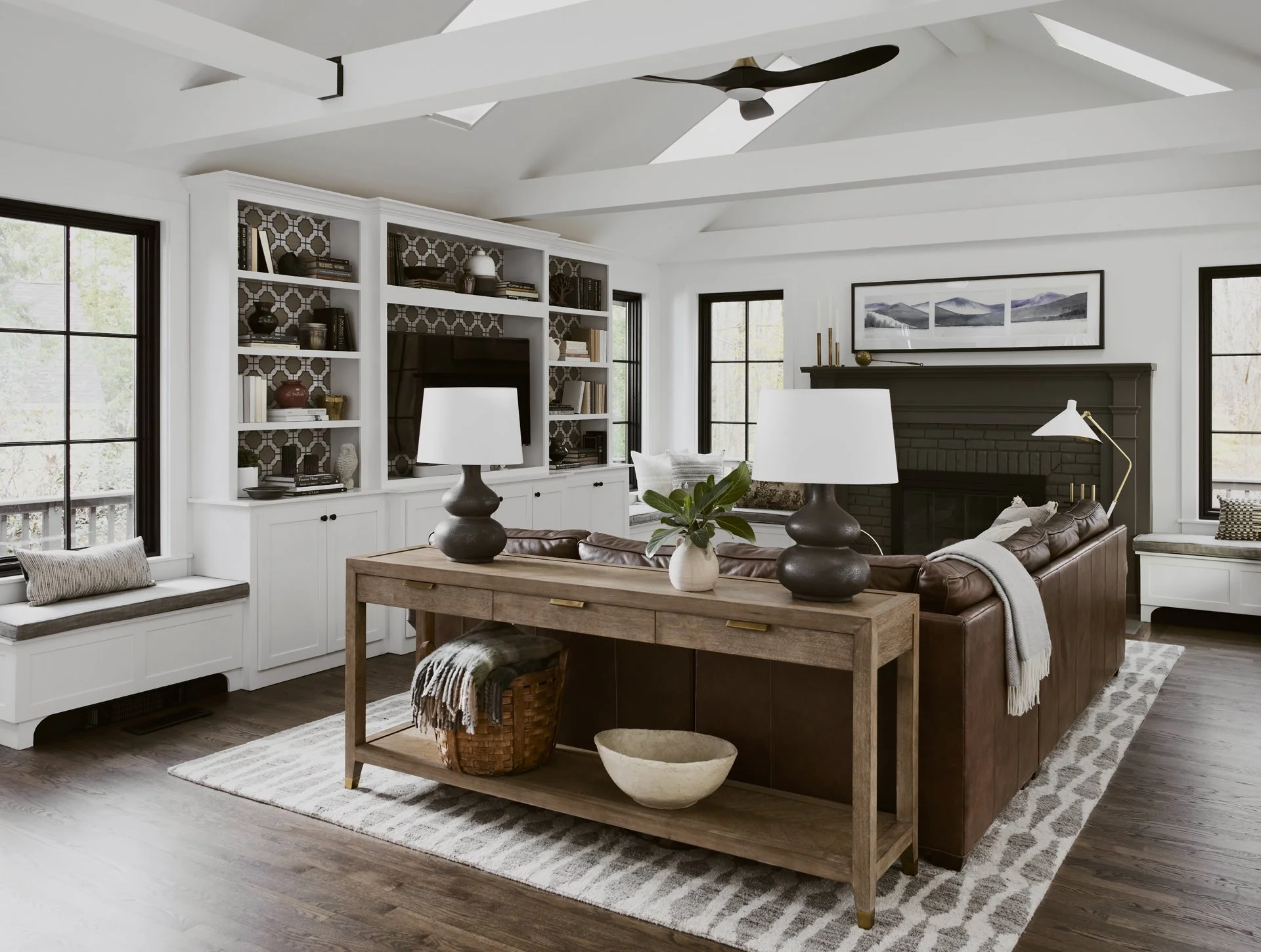 Sacris Design traditional interior design living room with custom built-in bookcases and patterned grasscloth wallpaper backing, North Andover Massachusetts