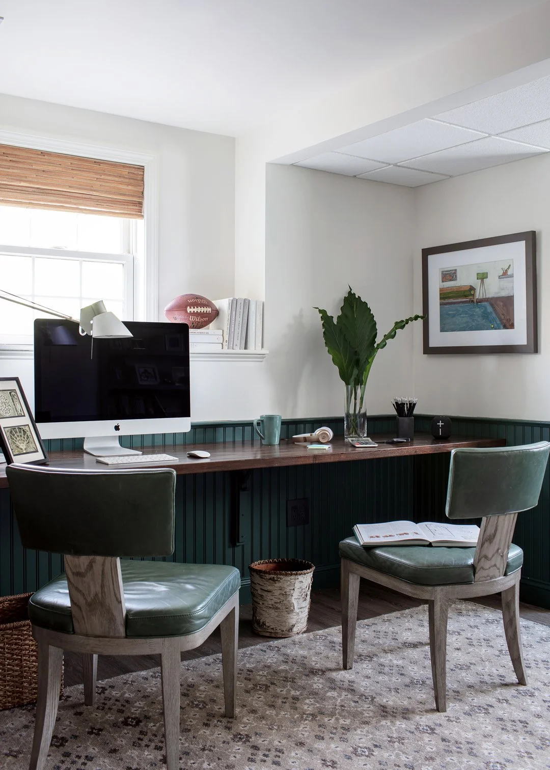Children's homework office with dark green beadboard wainscoting, walnut stained built-in desk, and green leather chairs — full service interior design on the North Shore of Massachusetts by Sacris Design