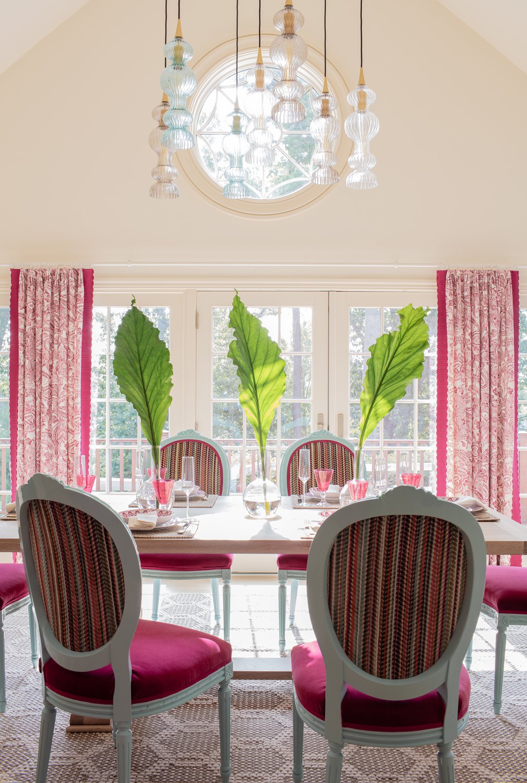 Sacris Design Portsmouth New Hampshire dining room wide angle with vaulted ceiling, bull's eye round window, glass pendant cluster and French doors to deck, New Castle NH