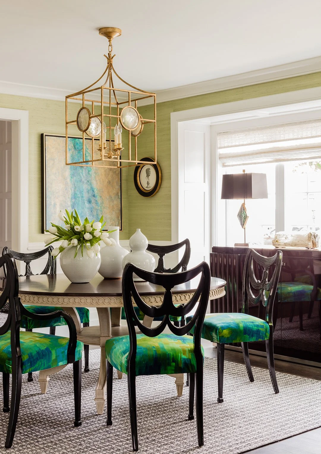 Sacris Interior Design luxury dining room with green grasscloth walls and black lacquered chairs with bold green upholstery, Essex County Massachusetts