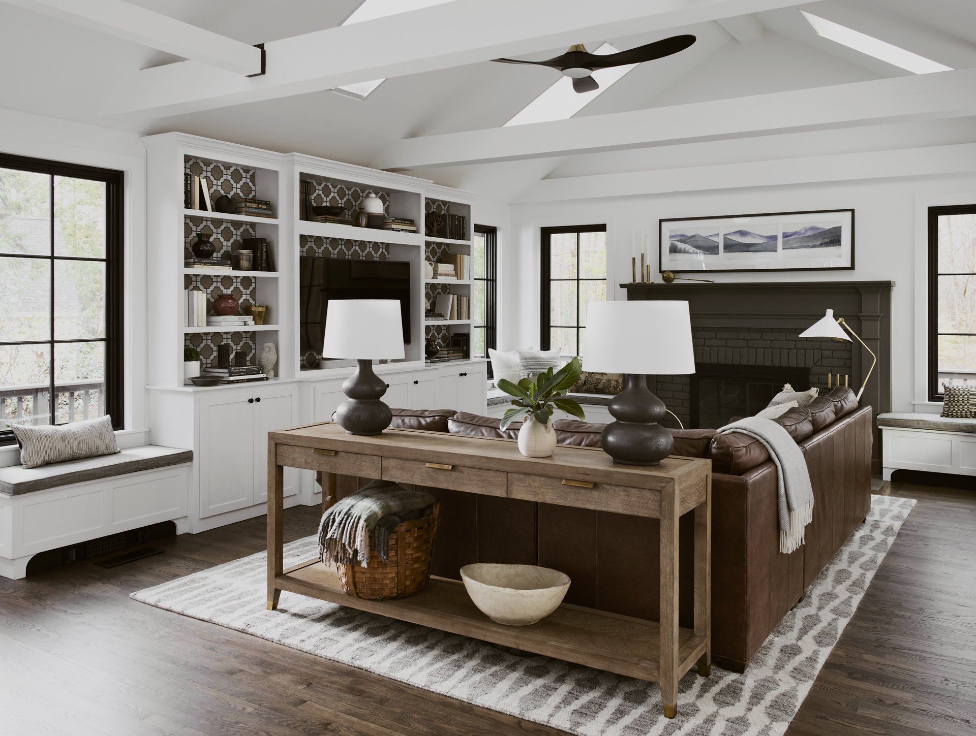 Sacris Design traditional interior design living room with custom built-in bookcases and patterned grasscloth wallpaper backing, North Andover Massachusetts