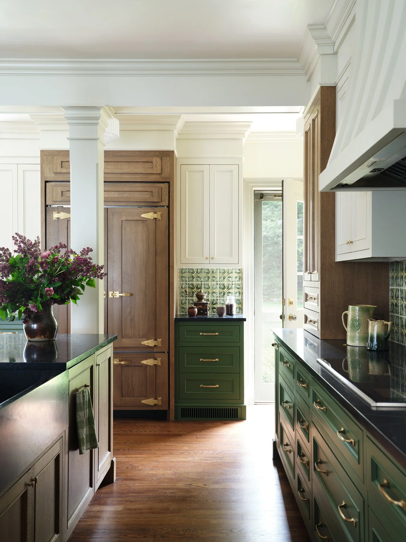 SACRIS kitchen with quartersawn oak paneled refrigeration, painted green cabinetry, unlacquered brass hardware and soapstone counters, Nashua New Hampshire