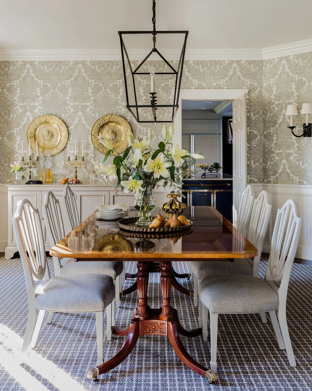Formal dining room with damask wallpaper, antique mahogany pedestal table, and Hepplewhite-style chairs — traditional luxury interior design on the North Shore of Massachusetts by Sacris Design