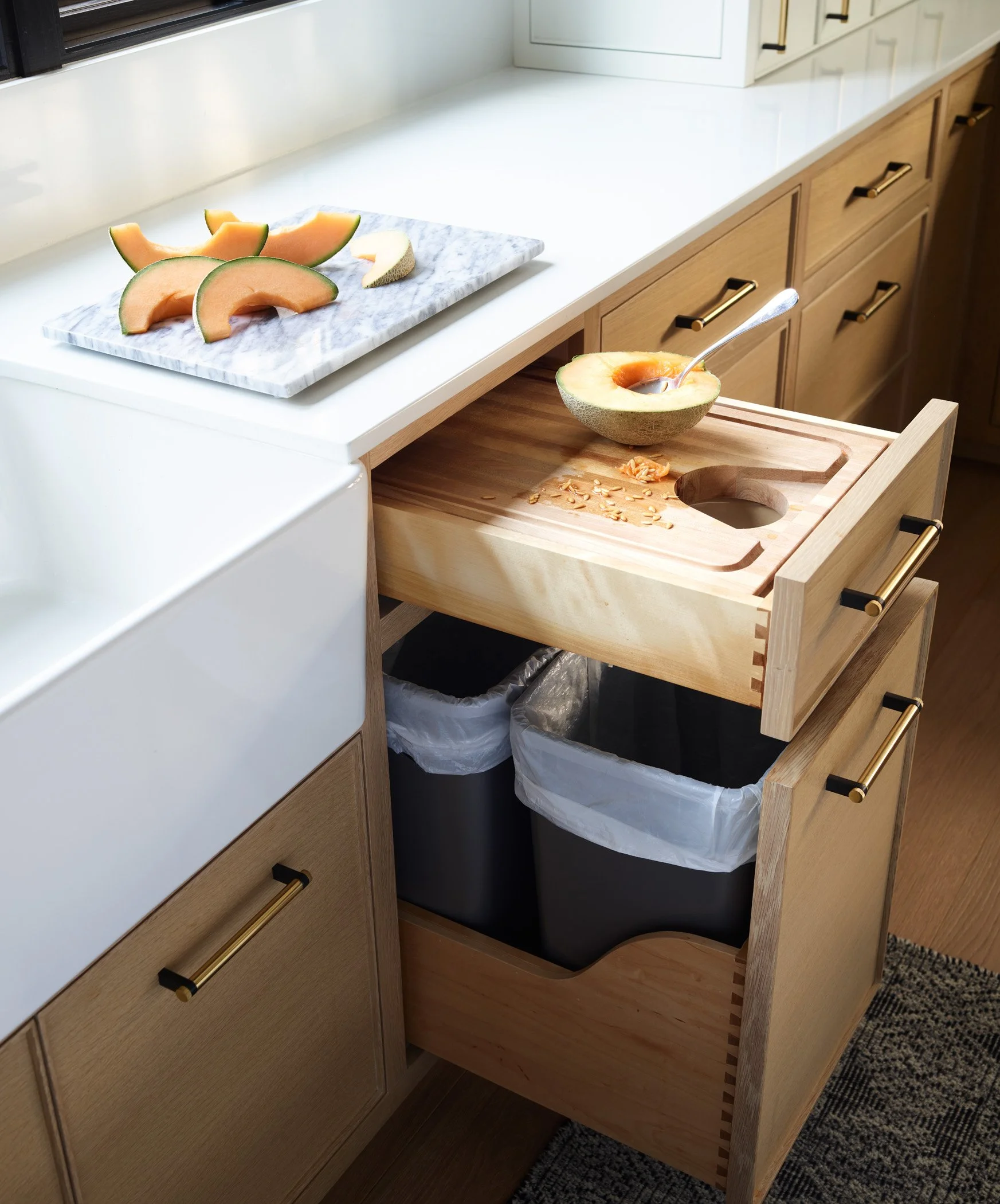 custom-cutting-board-over-trash-cabinetry-massahcusetts-kithcen-designer-sacris-design
