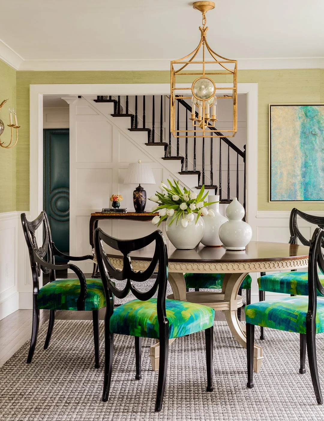 Sacris Design high end dining room with green grasscloth walls and gold geometric lantern, serving York County Maine and North Shore Massachusetts