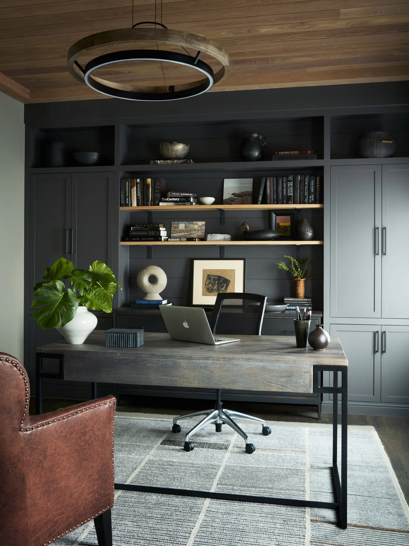 SACRIS home office with charcoal shiplap built-ins, white oak ceiling, reclaimed wood desk, wool rug and Visual Comfort Grace chandelier, North Andover Massachusetts