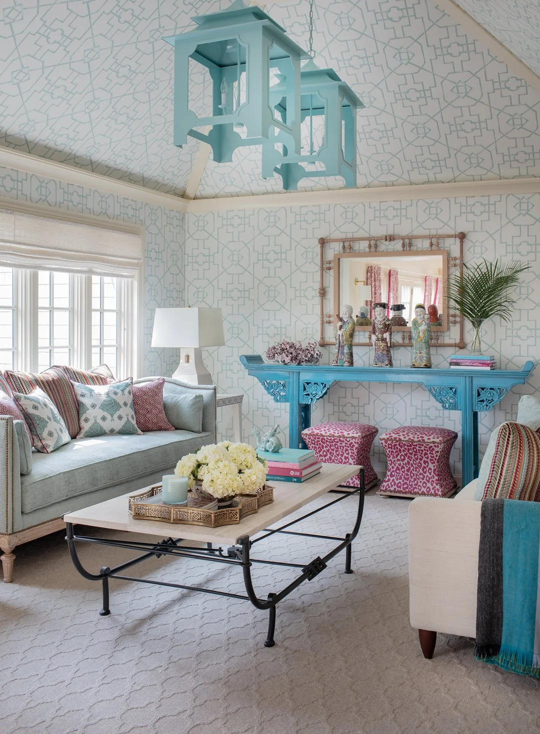 Sacris Design coastal New Hampshire living room with hipped ceiling, trellis wallpaper, chinoiserie console and raspberry leopard ottomans, New Castle Portsmouth NH